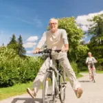 depositphotos_166976724-stock-photo-happy-senior-couple-riding-bicycles