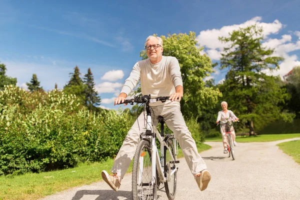depositphotos_166976724-stock-photo-happy-senior-couple-riding-bicycles